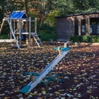 Children's play area with rubber bark TBHC